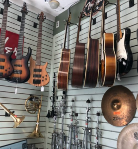 Wall of guitars and other instruments