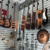 Wall of guitars and other instruments